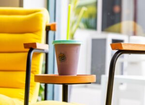 color-changing cup sitting on table next to yellow chair