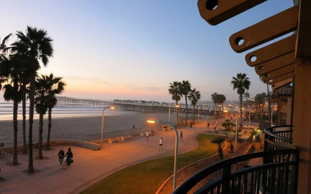 The Pacific Beach boardwalk and Crystal Pier at dusk